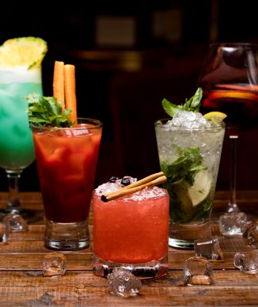 cold cocktails of different colors on the table