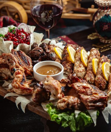 mixed fried meat with pomegranate and sauce